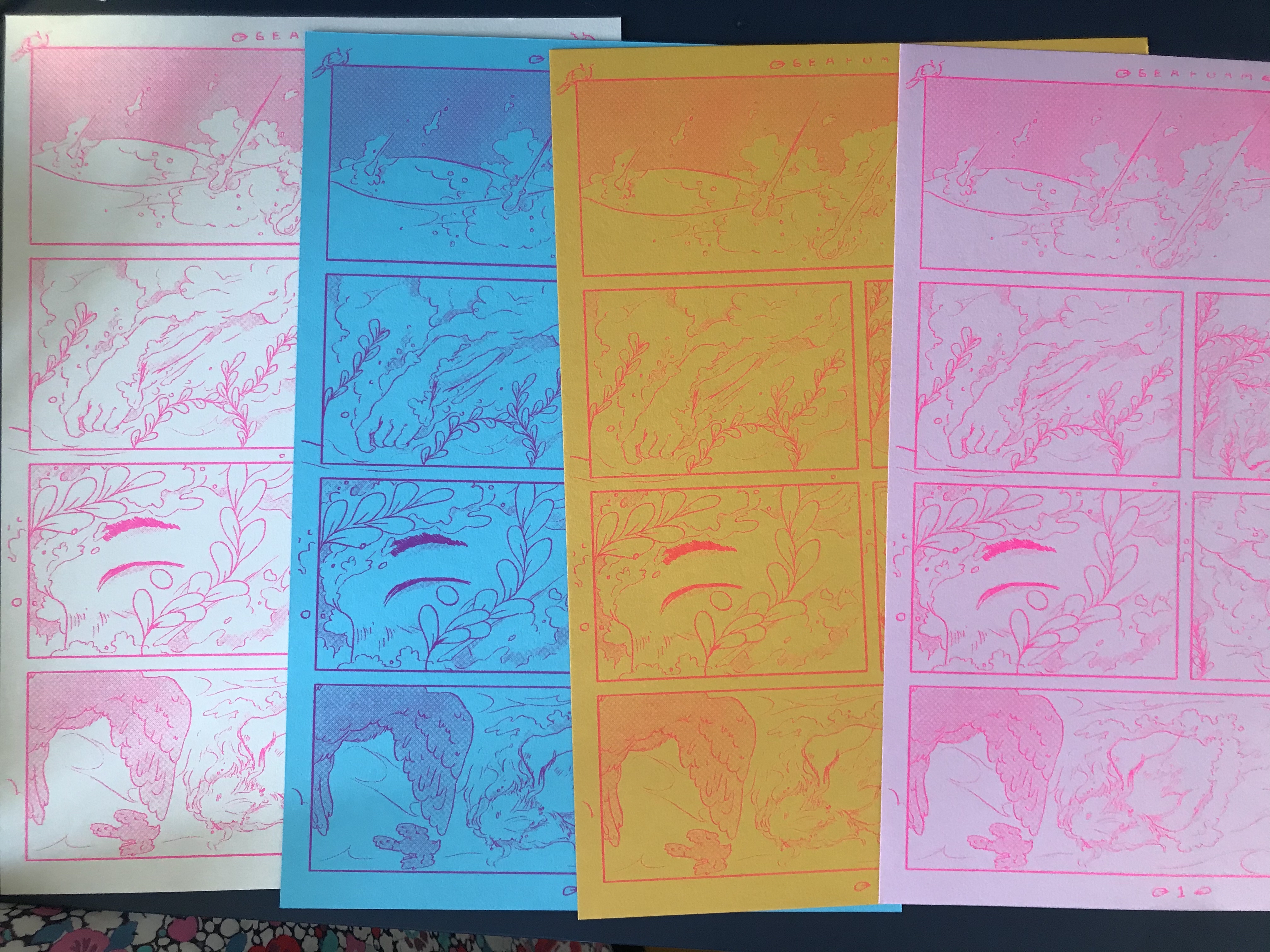 Four riso prints in different colours of the same comic page, depicting a woman falling from earth into the sea, but only half of the page is visible. left to right, the colours are pink on white, purple on blue, red on yellow, and pink on paler pink.
