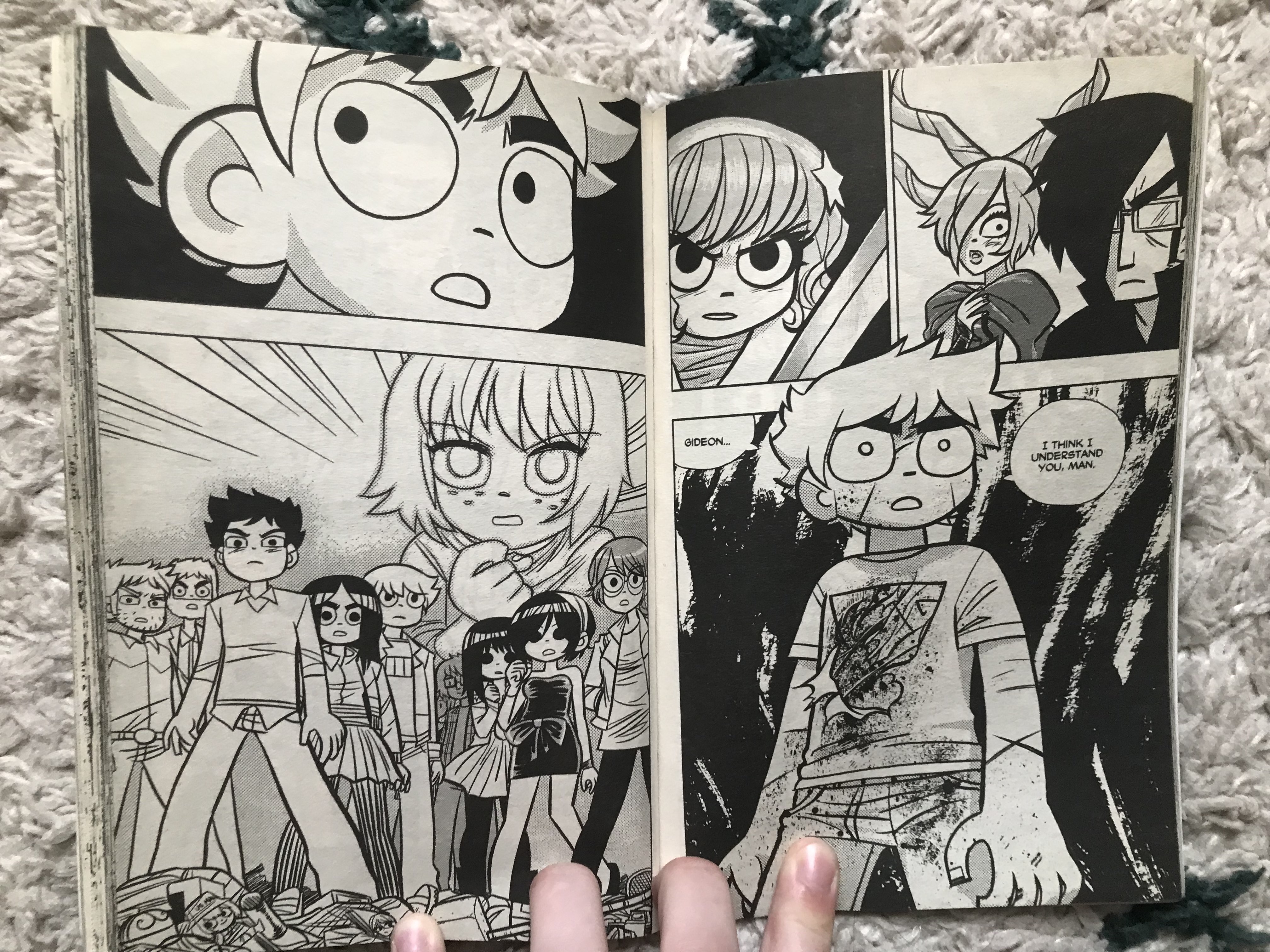 A photo of two pages from Scott Pilgrim, showing Scott, in the final fight with Gideon, with the supporting characters behind him, saying that he understands Gideon.
